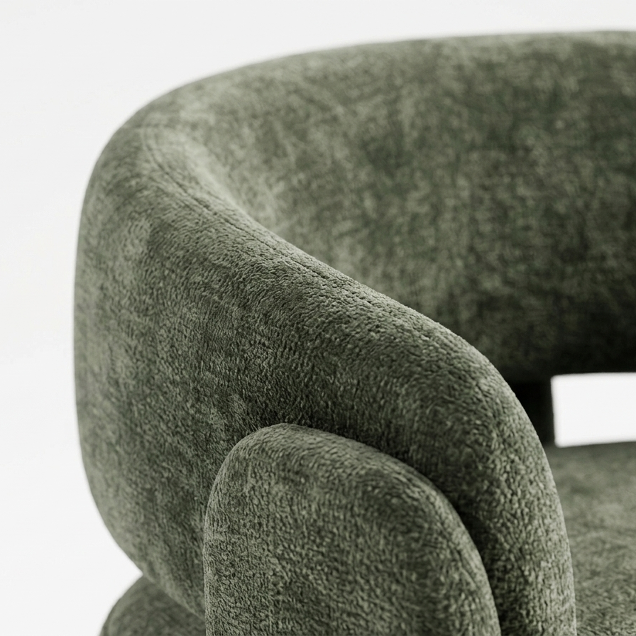 Boucle fabric texture close-up sage green curved armchair upholstery detail