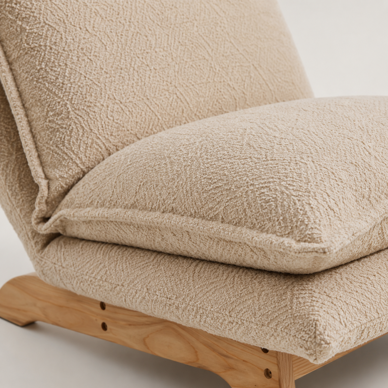 Plush coconut boucle cushion close-up layered seat natural woven texture
