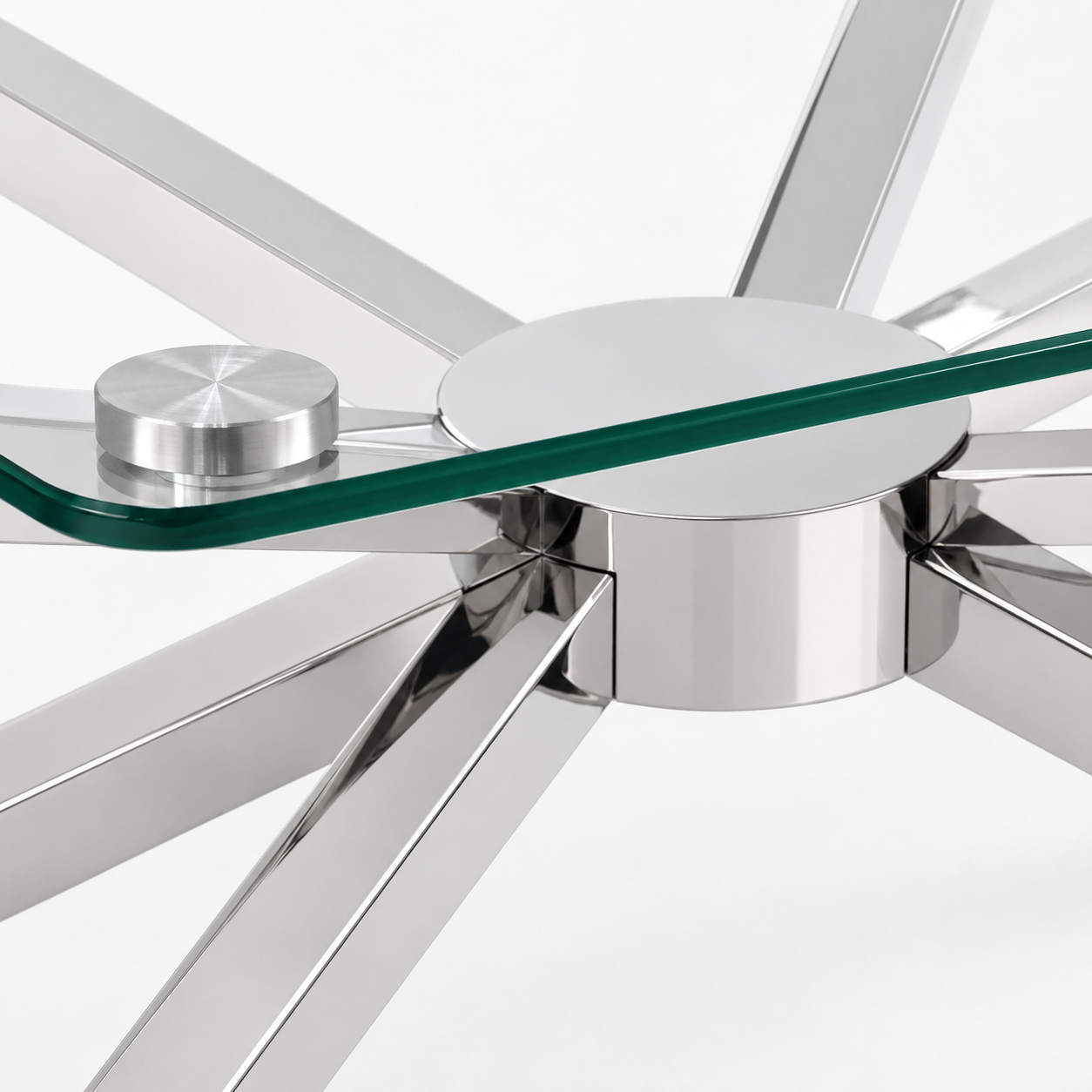 Polished chrome starburst hub close-up glass edge stainless steel coffee table