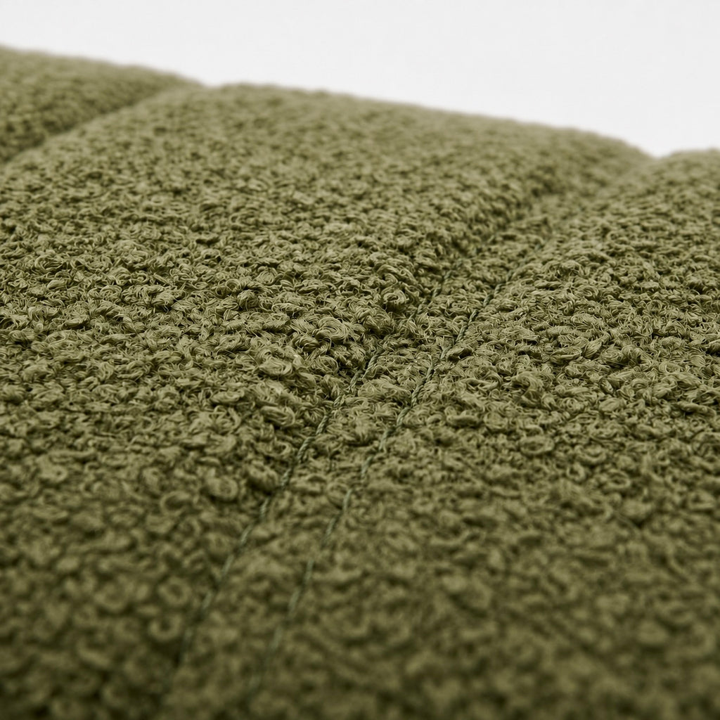 Close-up spinach chenille fabric texture channel stitching upholstery