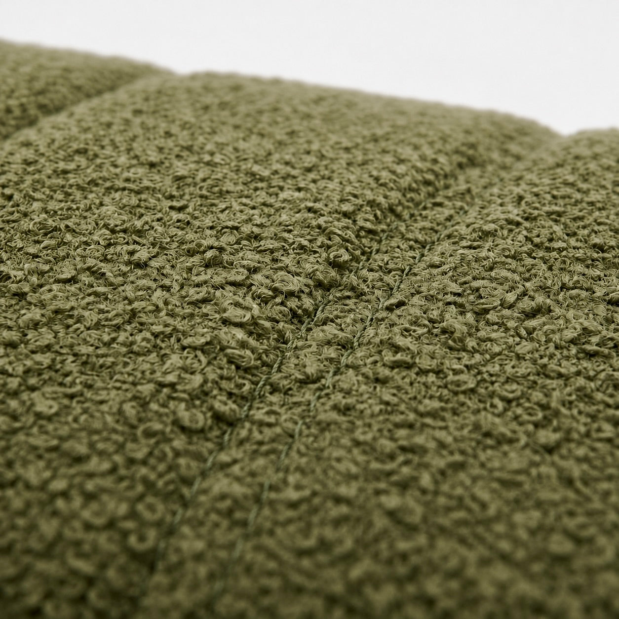 Close-up spinach chenille fabric texture channel stitching upholstery