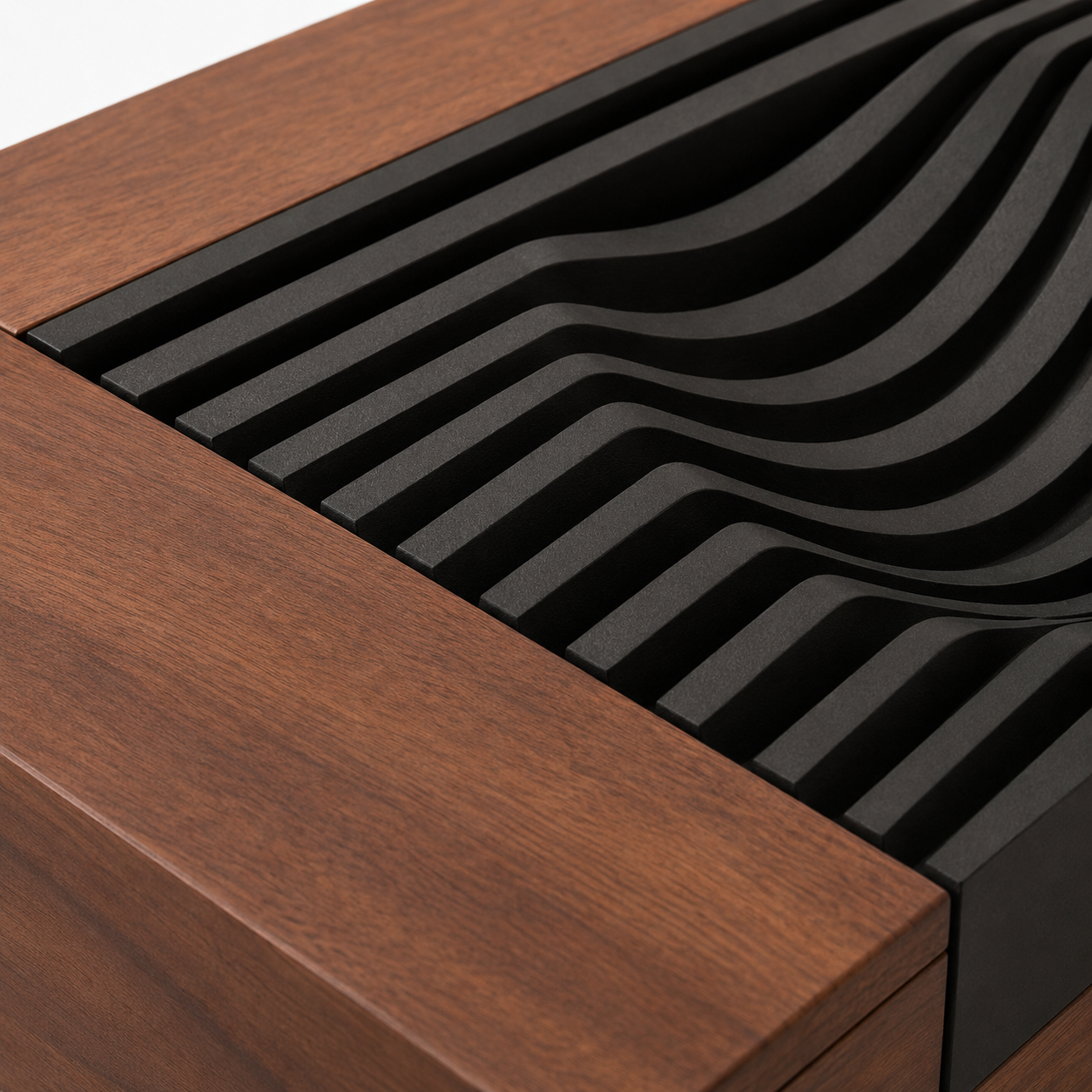 Carved matte black wave panel texture on walnut wood surface close-up